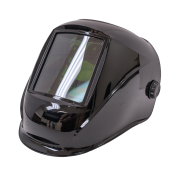 A full face welding helmet resting at a 3/4ths angle facing towards the left of the screen.